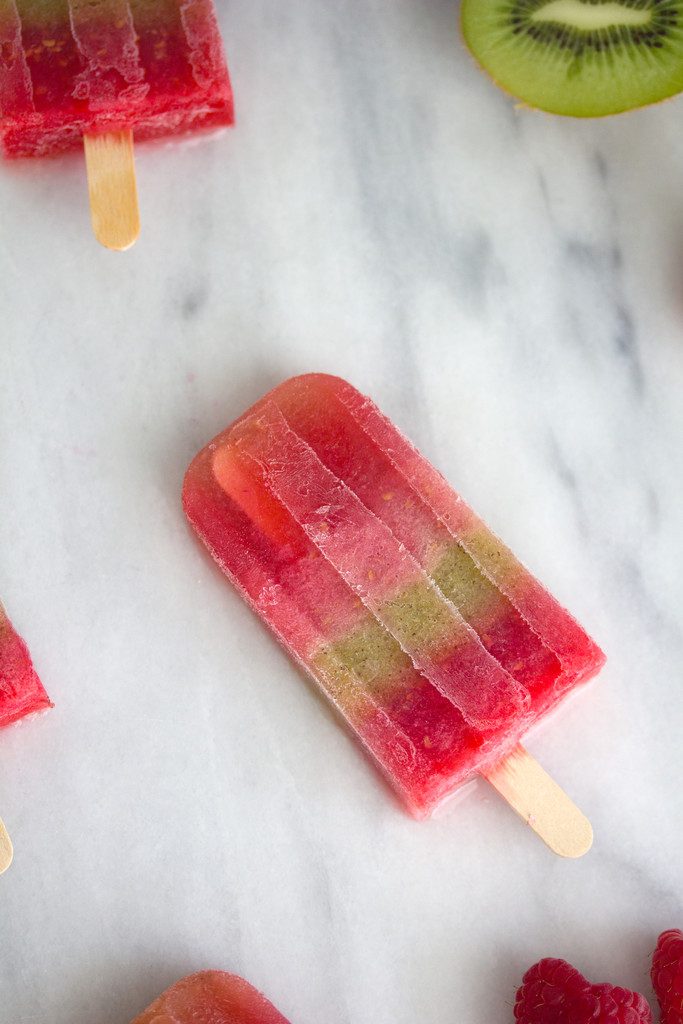 Raspberry and Kiwi Sangria Popsicles -- A summertime treat for adults only | wearenotmartha.com