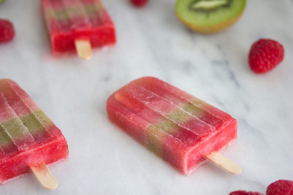 Raspberry and Kiwi Sangria Popsicles -- A summertime treat for adults only | wearenotmartha.com